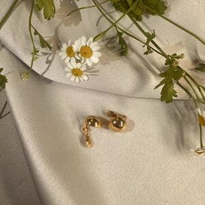 Vintage Monet round yellow gold clip on earrings